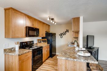 Spacious kitchen with dishwasher, refrigerator, disposal and microwave